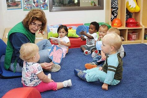 A military daycare worker read to children at a Fort Drum, New York, child development center. Michelle Kennedy/U.S. Army Wellington School, Daycare Worker, Home Day Care, Learning Preschool, Family Child Care, Preschool Programs, Military Kids, Home Daycare, Better Parent