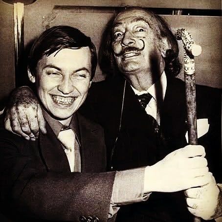 Happy Birthday to Anatoly Karpov! . . Here pictured with the artist Salvador Dali in New York in 1979. Karpov  remembers; . "Salvador was accompanied by two gorgeous girlfriends from his fans, while I was followd by the KGB guy..." . . Karpov was the World chess Champion for 10 years (1975-85) . He was known for his precision and methodical style. His attritional play would wear opponents down and his method began to be known as the "boa constrictor" . "Happiness should always remain a bit incom Anatoly Karpov, Bobby Fischer, Salvador Dali Art, Dali Art, Sporting Legends, Chess Players, Game Theory, Nyc Restaurants, Salvador Dali