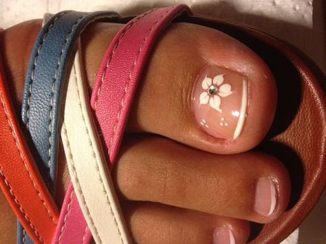 pedicure french nail polish flower Pedicure Designs Flower, White Pedicure Toenails Flower Designs, French Tip Pedicure With Flower Design, French Toes With Flower, 90s Pedicure, Pedicure Ideas Flower, French Pedicure With Flower, Pedicure With Flower, Pedicure Flower