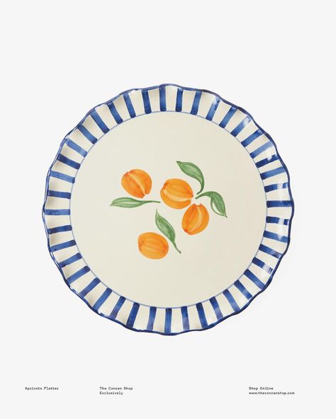 Our Apricot Platter is crafted in a family-run factory nestled in Puglia, Italy, renowned for its heritage in producing world-class ceramics. Each piece undergoes a meticulous hand-finishing process, featuring delightful apricot illustrations adorning the centre of the bowl and an intricate waved edge delicately accented with cobalt blue stripes. The vibrant colour palette of blue and peach imbues a feeling of an Italian summer into your home, creating a stunning centrepiece that is equally ... Amalfi Coast Ceramics, Ceramic Paint Designs, Cute Plates Aesthetic, Pottery Painting Pasta Bowl, Pottery Painting Ideas Blue, Platter Painting Ideas, Pasta Bowl Pottery Painting, Pottery Art Painting, Pottery Painting Ideas Bowls