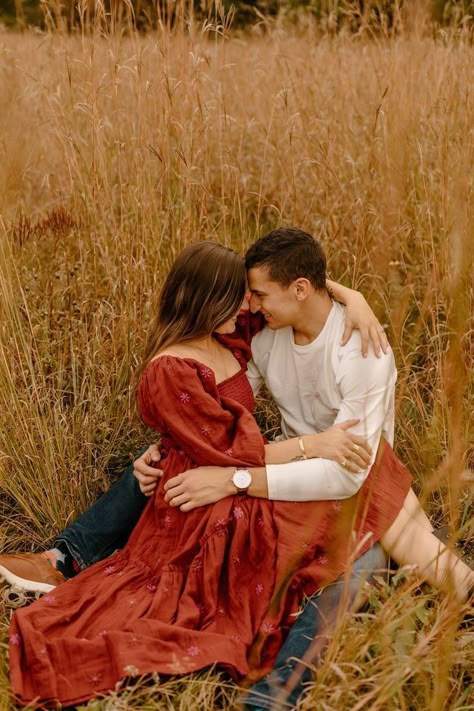 Fall Couple Photos Dress, Couples November Photoshoot Outfits, Coordinating Couple Outfits For Pictures Fall, Couple Outfit Ideas For Pictures Fall, Romantic Fall Engagement Photos, Couples Photos Red Dress, Couple Poses With Dress, Fall Engagement Outfit Ideas Dress, Burgundy Engagement Pictures Outfit