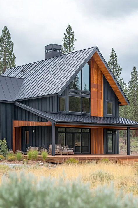 Charming metal cabin with large windows and wooden accents set in a lush landscape. Unravel the quirky charm and rock-solid perks of metal building homes, where modern design meets durable dinosaur-era construction vibes! Black Metal Siding Exterior, Steel Siding House, Vertical Metal Siding, Barn House Conversion, Siding House, Cabin Modern, Dinosaur Era, White Siding, Steel Siding