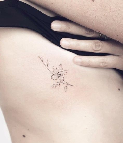 Lily Tattoo Dainty, Small Lilies Tattoo, Daffodil Tattoo Ribs, Dainty Side Tattoos, Small Azalea Flower Tattoo, Lily Simple Tattoo, Jasmine Flower Tattoo Minimalist, Daffodil Rib Tattoo, Unique Minimalist Tattoos For Women