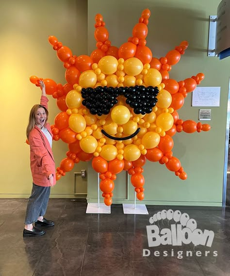 This photo is of a balloon sculpture made to look like the sun, smiling and wearing sunglasses in a very fun and fanciful way. This was created for Microsoft on their Redmond campus in July 2022. Balloon Sculptures Diy, Sun Balloon, Link Balloons, Balloon Arch Decorations, Balloon Template, Deco Ballon, Balloon Words, Balloon Crafts, Large Balloons