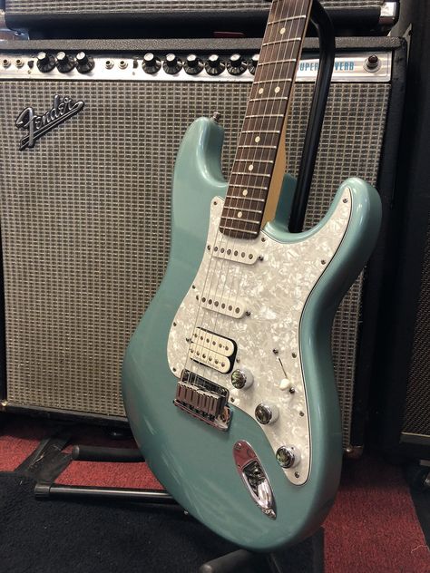 A cool Fender with vintage vibe, this 2000 American Series Fat Stratocaster features a teal green metallic finish, pearloid pickguard and backplate, and American Series tremolo, tuners, and hardware. Comes equipped with a Seymour Duncan Pearly Gates... Guitar Chord Progressions, Music Corner, Chord Progressions, Pearly Gates, Guitar Chords And Lyrics, Green Electric, Guitar Obsession, American Series, Cool Electric Guitars