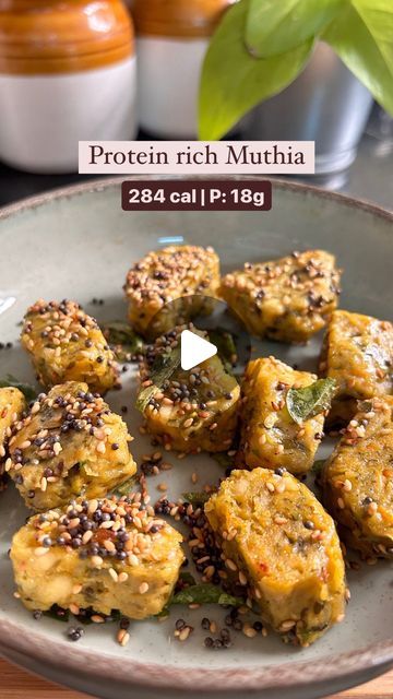 Aasra | Conscious cooking for the Indian palate 👩🏽‍🍳 on Instagram: "Get 18g of protein from this delicious Gujarati snack/breakfast recipe—Muthia!

Adding protein to your favorite meals is the easiest way to upgrade your diet. This recipe shows how you can sneak protein into your meals without making drastic changes. The taste of Muthias remains the same, but they become more nutritious and balanced, keeping you full for hours.

High-protein meals help you stay full longer, reduce hunger pangs, and keep you on track with your overall calorie and weight goals. 

If you try this recipe, please tag me or send a DM—I’d love to hear your thoughts!”

Nutritional value (approx): 284 cal per serving 
Contains 6-8 bites of muthias
C: 28g | P: 18g | F: 11g

Ingredients (serves 3-4 people, you can High Protein Indian Breakfast, High Protein Breakfast Vegetarian, Stay Full Longer, Vegetarian Protein Recipes, Food Reels, Gujarati Snacks, Hunger Pangs, Weight Goals, Low Calorie Breakfast