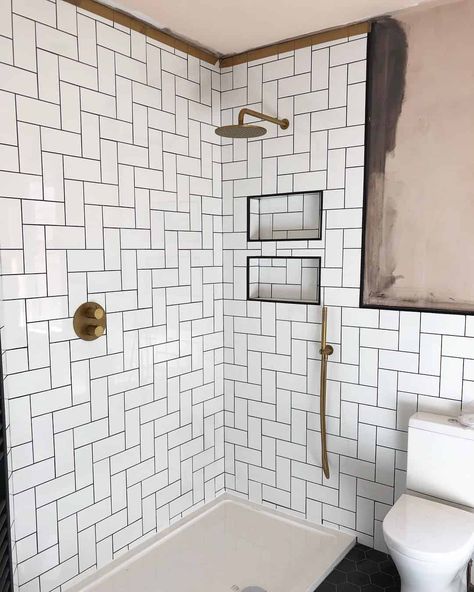 Stand up shower with white subway tiles done in a step-ladder pattern. Look closely and you’ll see the rest of the bathroom is boasting black honeycomb tiles. The contrast of black and white create a stunning look. White Tile Black Grout, White Tiles Black Grout, Honeycomb Tiles, Large White Tiles, White Shower Tile, Types Of Tiles, White Subway Tile Shower, Grey Marble Tile, White Tile Shower