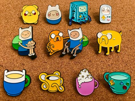 "Purchasing this listing will give you 11 brand new Adventure Time enamel pins. All purchases will be shipped immediately with a free bonus pin! The bottom row of cup pins are 0.75\" tall and the rest are 1-1.5\" tall. Rubber backings and ziplocs are included for each pin. Thank you! :)" Adventure Time Merch, Png Clothes, Dbz Art, Jake The Dogs, Adventure Time Art, New Adventure, Disney Fun, Cute Pins, New Adventures