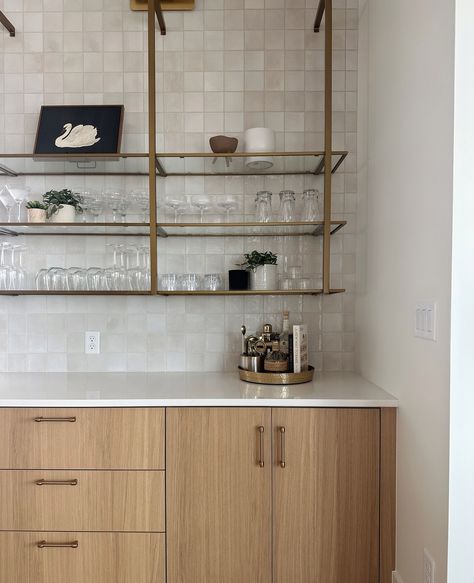 A wet bar is a perfect spot to add a little personality to your kitchen or dining space. Adding in touches of vintage decor along with practical glassware makes the space harmonious and interesting. Cheers! ⁠ ⁠ Design: @laurensmythdesign ⁠ Builder: @tealpoint_customhomes⁠ ⁠ ⁠ .⁠ .⁠ .⁠ .⁠ .⁠ .⁠ ⁠ #interiordesign #interiorstyling #kitchendesign #boise #boiseidaho #classichomes #eagleidaho #northwestmodern #organicmodern #beautifulhomes #rusticmodern #homedesign #boiseinteriors #kitcheninspo #ba... Wet Bar With Mirror, Dry And Wet Kitchen Design, Mid Century Modern Wet Bar, Modern Wet Bar, Open Kitchen Shelves, Dry Bar, Metal Shelves, Wet Bar, Kitchen Shelves