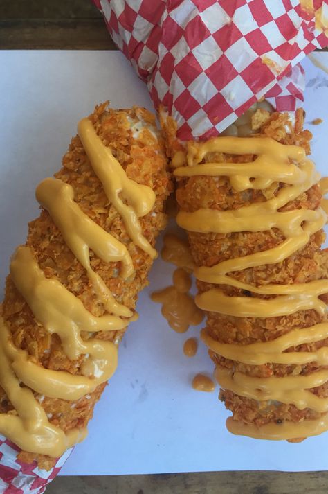 Cheesy Nacho Corn on the Cob: Roasted corn on the cob lightly coated with crushed Dorito® corn chips and nacho cheese. At Texas Steak Out, located on the west side of Underwood St. between Lee & Randall avenues. (Courtesy of Minnesota State Fair) Carnival Eats Recipes, Minnesota State Fair Food, Roasted Corn On The Cob, Carnival Eats, Carnival Foods, Texas Steak, Fair Recipes, Country Sausage Gravy, Gameday Food