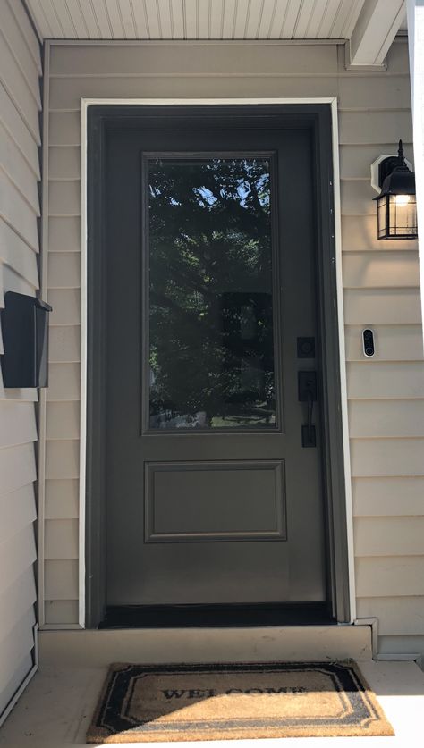 Single 3/4 lite single panel front door in Sherwin Williams urbane bronze, matte black hardware from Schlage Panel Front Door, Black Exterior Doors, Urbane Bronze, Single Entry Doors, Black Front Door, Tan House, Front Door Hardware, Exterior Doors With Glass, Black Front Doors