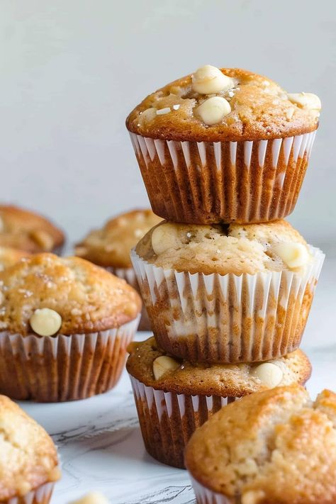 These white chocolate muffins are oh-so-heavenly! Moist, fluffy, and studded with sweet white chocolate chips, these treats are perfect for breakfast or dessert. White Chocolate Chip Muffins, Vanilla Choc Chip Muffins, Muffins With White Chocolate Chips, Pumpkin Muffins With White Chocolate Chips, Muffins White Chocolate, Vanilla Chocolate Chunk Muffins, Choc Chip Muffins, White Chocolate Muffins, Best White Chocolate