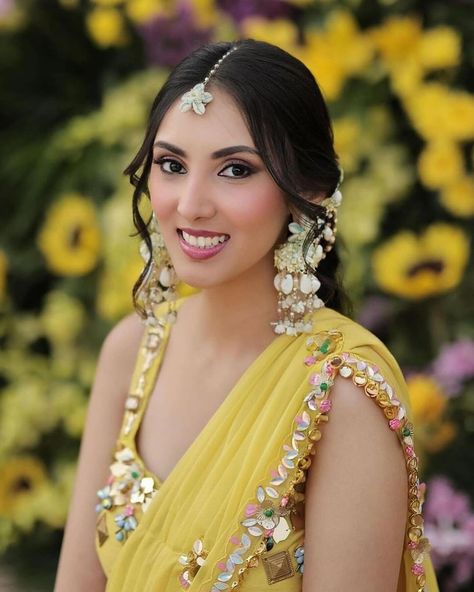 The combination of the yellow lehenga, delicate coiree jewelry, and elegant hairstyle is creating the perfect look for the bride’s Haldi ceremony💕🌼 Haldi Jwellary For Bride Unique, Groom Haldi Decoration, Bride Haldi Dress, Haldi Outfits Ideas, Bride Haldi Outfit, Haldi Jewellery Bridal Flowers, Simple Haldi Look For Bride, Haldi Outfit For Men, Haldi Accessories