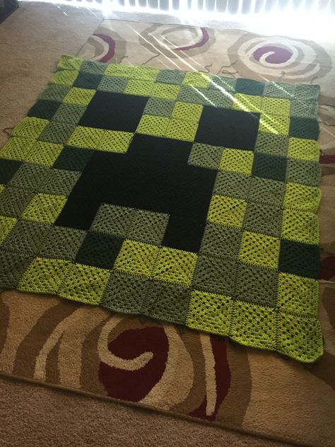 Minecraft creeper granny square crochet blanket. Www.facebook.com/nerdyknits2013 Creeper Crochet Blanket, Crochet Creeper Blanket, Crochet Minecraft Granny Square, Stranger Things Crochet Blanket, Minecraft Crochet Ideas, Random Granny Square Blanket, Minecraft Crochet Blanket, Crochet Minecraft Blanket, Crochet Creeper