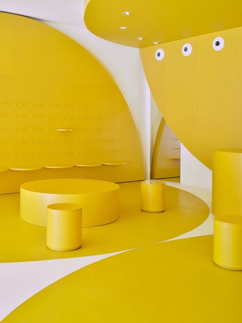 sunset sneakers shop in mallorca by studio animal invites visitors to step into summer Green Terrace, Yellow Palette, Behind The Glass, Yellow Interior, Fruit Stands, Timber Structure, 2d Design, Glass Facades, Design Your Dream House