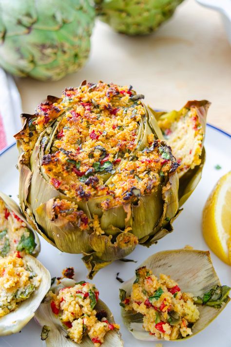 How to cut, cook, and eat whole artichokes plus a stuffed artichoke recipe featuring a breadcrumb mixture with a citrusy vinaigrette. Artichoke Recipe, Cantaloupe Smoothie, Stuffed Artichokes, Spring Dishes, Citrus Vinaigrette, Artichoke Recipes, Vegetarian Appetizers, Gluten Free Pasta, Dairy Free Recipes