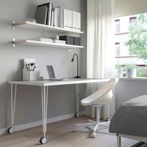 One thing you want to consider with desk-on-wheels setups is that they are definitely not as stable as stationary setups. Ikea Linnmon, Interior Ikea, Sewing Desk, Ikea Ireland, Ikea Desk, Plastic Edging, Plastic Tables, Ikea Family, White Desks