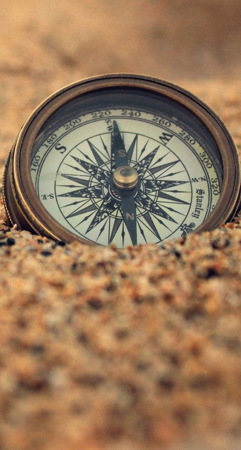 Compass in the sand iPhone wallpaper Compass Wallpaper, Wallpaper Travel, Map Wallpaper, A Compass, Travel Wallpaper, Compass Rose, Travel Maps, Pirates Of The Caribbean, A Quote