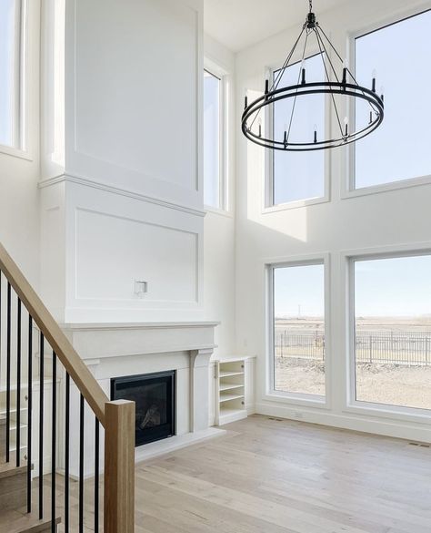 White Fireplace Vaulted Ceiling, 2 Story Living Room Molding, Two Story Fireplace With Windows, Wainscotting With Vaulted Ceiling, Living Room With Tall Fireplace, 18ft Ceiling Living Room, 2 Story Great Room Ideas Fireplace, Floor To Ceiling Fireplace With Tv, Tall Wall Fireplace Ideas