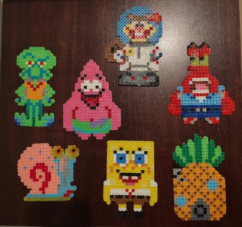 Made with perler beads and magnets on the back for refrigerator Squidward Perler Beads, Spongebob Perler Bead Patterns, Barbie Perler Beads, Large Perler Bead Patterns, Spongebob Perler Beads, Spongebob Perler, Perler Bead Wall, Melt Beads Patterns, Rainbow Loom Designs