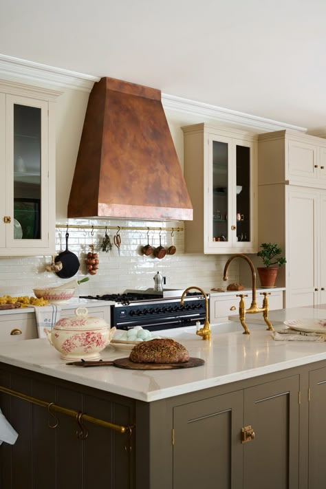 Our first impression when we saw this kitchen was that it had a French country feel, the bespoke copper hood definitely added to this look. #deVOLKitchens #CookerHood #KitchenExtractor Dinner Bell Kitchen, For The Love Of Kitchens Devol, Copper Hood Kitchen, Kitchen Tails, Federal Style Interior, Green And Copper Kitchen, Range Alcove, Philly Row Home, Colonial Style Kitchen