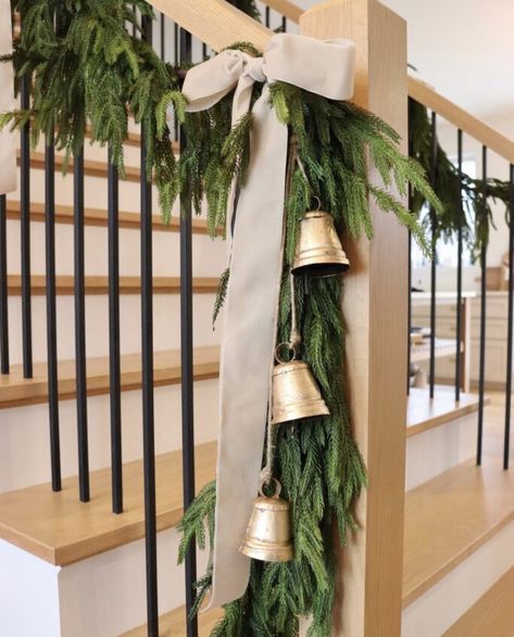 We're sharing Christmas staircase decor ideas over on our blog that you will love! These are easy to recreate and won't break your budget. Head over to our blog for more details and links to everything seen here! Christmas Stair Banister Decor, Spiral Staircase Christmas Decor, Stair Rail Christmas Decor, Holiday Staircase Decor, Railing Christmas Decor, Christmas Railing Decor Indoor, Banister Christmas Decor, Outside Stair Railing, Garland For Staircase