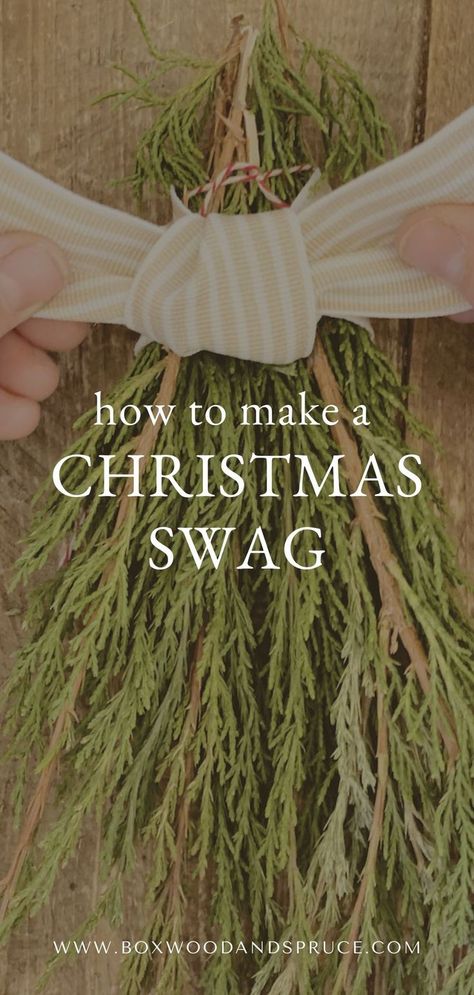 fingers tying a ticking stripe ribbon on a christmas swag Pine Swags Christmas Diy, Christmas Swags Ideas Diy, Cedar Boughs, Diy Swag, Cedar Wreath, Christmas Swag, Swag Wreath, Hanging Garland, Christmas Greenery