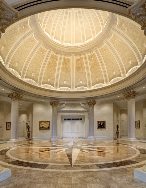 Towne University's interior’s grand entry centerpiece is a ceiling dome encircled with eight fluted Corinthian columns, all of which sit atop a granite and marble floor inlaid with a compass rose centerpiece. Photo (c) Studio SMW Corinthian Columns, Interior Design Sketchbook, Rose Centerpiece, Ceiling Domes, Dome Building, Grand Entry, Granite And Marble, Dome Ceiling, Entry Design