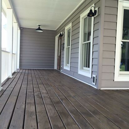 Why pay a professional when you can do it yourself? With some time and elbow grease, we were able to save a couple of hundred dollars by staining our entire covered front porch ourselves! It definitely was a project, but one that was worth it! By using a can of outdoor stain, we completely transformed the look and feel of our entire porch! This was an all day project but the reward was worth it! We used Behr semi transparant stain that we picked up from our local Home Depot. The st… Deck Stain Colors, Deck Stain, Pergola Diy, Diy Staining, Deck Colors, Pergola Design, Staining Deck, Diy Porch, Porch Flooring