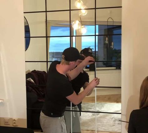 Easy DIY IKEA Mirror Wall Tutorial Feature Mirror Wall Ideas, Hovet Mirror Ikea Living Room, Mirror Wall Studio Apartment, Ikea Large Mirror Hack, Ikea Mirror Tiles On Wall, Budget Mirror Wall, Mirror Tiles On Wall Bedroom, Diy Wall Of Mirrors, Mirror Squares Wall Diy