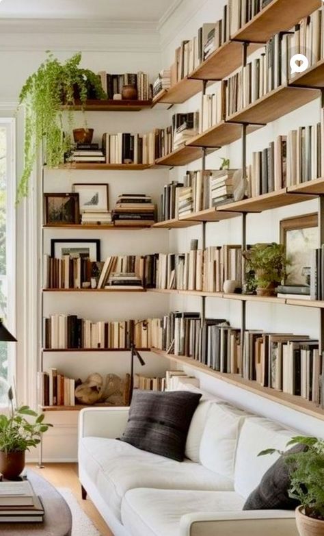 Bookcase Above Sofa, Bookshelves Above Sofa, Couch In Front Of Bookshelves, Floating Shelf Library, Modern Library Design Home, Home Library Design Cozy, Modern Home Trends, Surreal Interior, Books Living Room