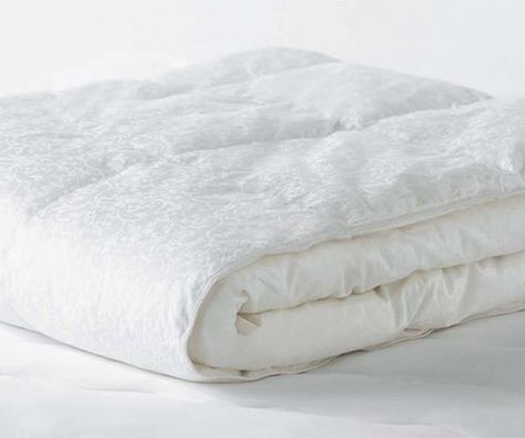 This down-alternative comforter tied to top the category. It performed almost as well as the down comforters and proved a quality product, especially for the price. Our consumer testers rated the Beyond Down average in appearance but, looks aside, it will definitely keep you warm. Wash in warm water on a gentle cycle, no bleach. Dry on low heat for at least three cycles or until completely dry. (amazon.com) Pros: • Beyond Down is the top down-alternative comforter in our durability tests. •... Down Blanket, Airy Bedroom, Fluffy Comforter, Down Comforters, Down Comforter, Good Housekeeping, Our House, Bed Pillows, Bedroom Decor