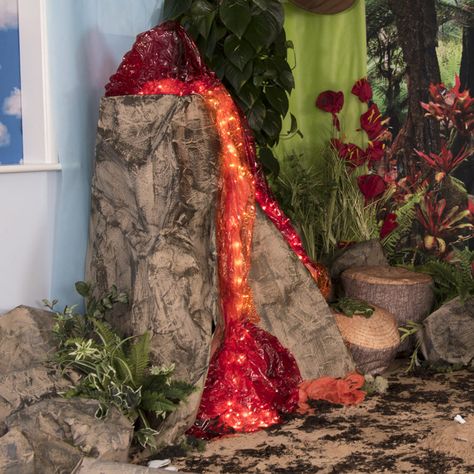 Volcano Prop Diy, Milk Jug Dinosaur Skull, Diy Large Volcano Prop, Volcano Classroom Display, Volcano Classroom Decoration, Dinosaur Decorating Ideas, Diy Dinosaur Backdrop, Birthday Charts Ideas, Volcano Decoration Party Ideas