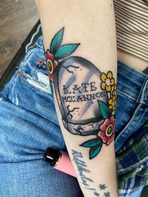 A headstone with flowers. The headstone reads “Kate McCannon” Colter Wall Tattoo Ideas, Western Traditional Tattoo Sleeve, Colter Wall Tattoo, Mama Tried Tattoo, Mmm Chezburger, Kate Mccannon, Headstone Tattoo, Country Song Tattoos, Gnarly Tattoos