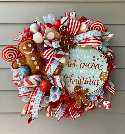 You can truly begin to smell the gingerbread with this adorable and whimsical wreath. Cute gingerbread wreath is such a fun loving decor piece to add your holiday decorations. Gingy will truly greet your guests with an adorable Merry Christmas this season.  Marcy's wreaths also make a beautiful and unexpected gift so give the gift of chic style this season. Marcy's Wreaths take pride in producing unique and beautiful designs for your front doors and home interior designs.  CARE - Upon receipt, cut the cable ties from the bottom of the box and carefully remove the wreath from the box. - Wipe clean with damp cloth as needed. - Keep out of direct sunlight. - To store wreath, recommend lightly wrapping it in tissue paper and storing flat in the box in which it arrived or a box of comparable si Whimsical Christmas Wreath Diy, Gingerbread Cabinet Decor, Gingerbread Wreaths Christmas, Gingerbread House Wreath, Coffee Wreath, Christmas Tree Goals, Christmas Theme Decor, Gingerbread Wreaths, Candy Wreaths