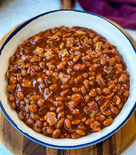 This Slow Cooker Crockpot Baked Beans with Bacon recipe offers the perfect balance of sweet and savory flavors, with tender beans slow-cooked in a rich sauce. The addition of bacon brings a delightful smokiness that complements the natural sweetness of brown sugar. Ideal for gatherings or a cozy family dinner, this side dish is sure to become a favorite. Baked Beans In The Crockpot, Crockpot Baked Beans Slow Cooker, Southern Style Beans, Bake Beans With Bacon, Brown Beans In Crockpot, Slow Cooker Baked Beans From Scratch, Bushes Baked Beans Recipe, Crockpot Baked Beans With Bacon, Hobo Beans Recipe