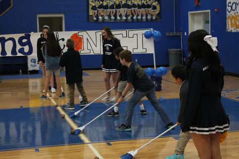 "Sweep" the potato to the other end. Fun game for pep rallies. Non Athletic Games, Homecoming Assembly Games, High School Pep Rally Games, Hoco Pep Rally Games, Pep Rally Game Ideas High Schools, Basketball Pep Rally Games, Pep Rally Games High School Ideas, Pep Rally Ideas Games, Assembly Games Highschool