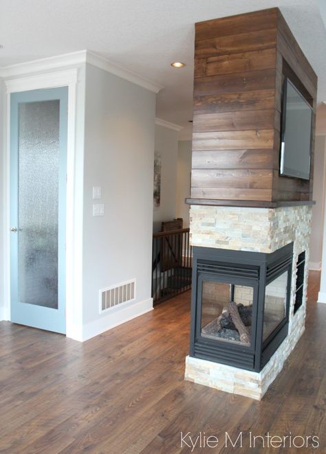 Pantry door painted Benjamin Moore Wedgewood Gray with Gray Owl walls. 3 sided fireplace with ledgestone and stained wood shiplap wall. Kylie M Interiors E-design and Online Color Consulting 3 Way Fireplace, Painting Wood Walls, Pantry Door Makeover, Benjamin Moore Wedgewood Gray, Bespoke Fireplace, Peninsula Fireplace, Wedgewood Gray, Accent Wall Bedroom Paint, Stained Shiplap