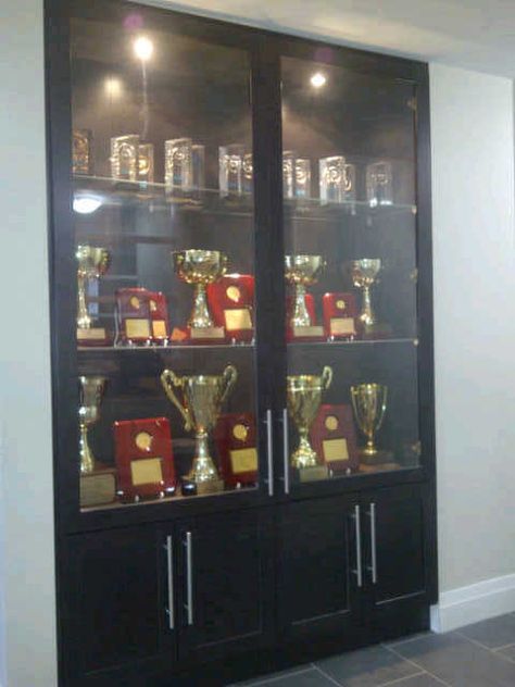 Our Trophy Showcase at the office Award Shelves, Trophy Display Shelves, Trophy Cabinets, Shoe Storage Design, Trophy Display Case, Wall Display Case, Modern Tv Room, Glass Cupboard, Trophy Display