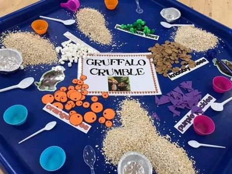 Bran flakes for knobbly knees.  Mini marshmallows for his terrible teeth.  Green pom poms for poisonous wart. Purple felt cut into triangles for purple prickles. Orange foam cut out for eyes.  Oats for the topping. Storytelling Week Eyfs, Into The Woods Eyfs, The Gruffalo Tuff Tray, The Gruffalo Eyfs, Gruffalo Crumble Tuff Tray, The Gruffalos Child Activities, Gruffalos Child Activities Eyfs, Gruffalo Activities Eyfs Toddlers, Adult Led Activities Eyfs