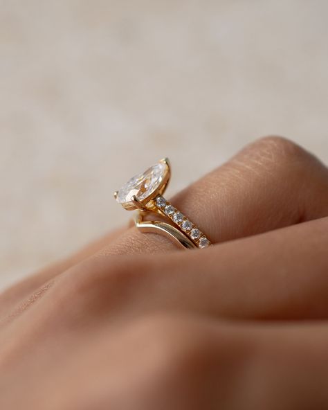 A matching pear engagement ring with plain curved wedding band Pear Engagement Ring With Wedding Band, Ring With Wedding Band, Pear Ring, Custom Engagement Rings, Classic Engagement, Instagram Wedding, Pear Engagement Ring, 2024 Wedding, Curved Wedding Band