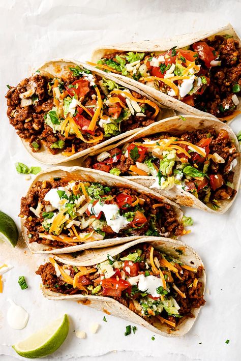 Five ground beef tacos arranged on parchment paper. Taco Dinner Ideas Ground Beef, Ground Beef Taco Recipes, Tacos Ground Beef, Taco Ground Beef, Taco Recipes Ground Beef, Make Taco Seasoning, Ground Beef Taco, Weeknight Dinner Recipes, Beef Tacos Recipes