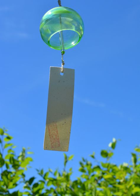 GREEN round HONAMI furin windchime  currently offering ✨ free shipping ✨ to orders to the US & Canada.  The Furin dates back to the Edo period in Japan. Each have a unique gentle chime which is said to be very relaxing. Hang outside, on your deck, or even in a window inside. Made from handblown glass, glass beads and handmade WASHI paper. Made in studio in Glen Williams, Canada     Each chime has a slight different sound - if you would like to hear the sound - please visit  instagram.com/studio_ Japanese Wind Chimes, Christmas Labels, Glass Fish, Edo Period, Washi Paper, Wind Spinners, Green Aesthetic, Japanese Garden, The Sound