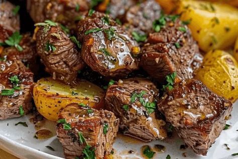 Enjoy tender steak bites and crispy potatoes made in the air fryer. A garlic butter recipe that's easy, flavorful, and perfect for weeknights! Sheet Pan Garlic Butter Steak Bites, Steak Potatoes Air Fryer, Stake Bites Air Fryer, Steak Bites And Potatoes With Garlic Butter Air Fryer, Garlic Steak And Potatoes Air Fryer, Air Fry Steak And Potatoes, Airfryer Steak And Potatoes, Steak Bites Recipes Air Fryer, Steak And Potatoes In Air Fryer