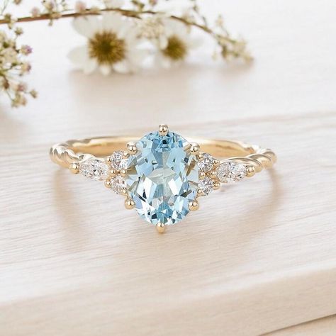 The oval-cut aquamarine stone reflects the peace and tranquility of the seas, while the marquise diamonds symbolize the eternity of your love. This elegant design combines both classic and modern styles for a unique look. Handcrafted, this ring will make your loved ones happy as a special gift. PRODUCT DETAILS ✰ Diamonds: 0.22 Carat Round & Marquise Cut ✰ Diamonds Clarity: SI F ✰ Aquamarine: 1.30 Carat Oval Cut ✰ 14K Solid Gold ✰ Rose Gold | White Gold | Yellow Gold ✰ You can choose gold color of rings. ✰ Aquamarine and diamond stones are 100% natural. ✰ Orders typically ship within 5-6 business days, excluding weekends + holidays. ✰ All orders are sent in the elegant gift box. ✰ You can see our other designs of gemstone rings in our shop. ✰ Please visit our shop: https://www.etsy.com/shop Aquamarine Vintage Engagement Ring, Blue Ring Engagement, Aquamarine Promise Ring, Aqua Marine Engagement Rings, Wedding Ring Aquamarine Gold, Engagement Ring With Aquamarine Accents, Marquise Aquamarine Ring, Elegant Aquamarine Wedding Rings, Promise Ring With Brilliant Cut Aquamarine