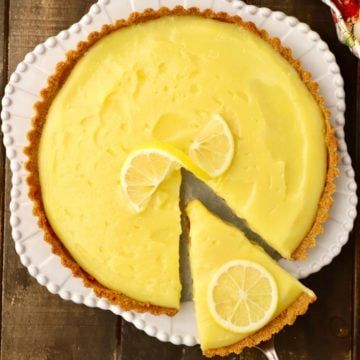 Lemon Tart with Gingersnap Crust Recipe - Grits and Pinecones Christmas Horderves, Lemon Lime Desserts, Gingersnap Crust Recipes, Creamy Flan, Baking Ideas Recipes, Tarte Vegan, Saturday Dinner, Holiday Meal Ideas, Lemon Tart Recipe