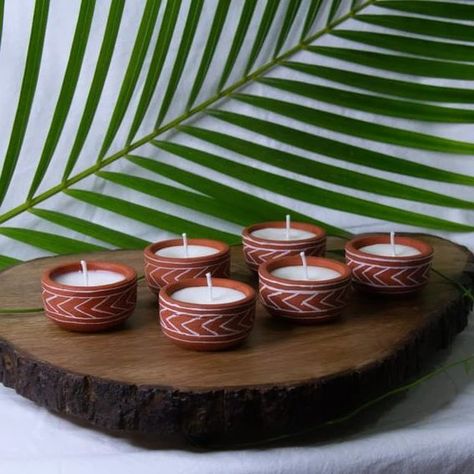 Hand painted Terracotta Soy wax mini candles- Arrows Design Dimensions - Dia 2.25" X H 1" Material - Terracotta & Soy Wax Color - Terracotta and white Features - Hand painted,Eco-friendly . . #clayart #post #postoftheday #positivevibes #celebration #festivevibes #diya #candle #brand Diya Candle, Terracotta Diy, Terracotta Candle, Clay Candles, Candle Shoot, Terracotta Decor, Candle Photoshoot, Diya Designs, Diwali 2022