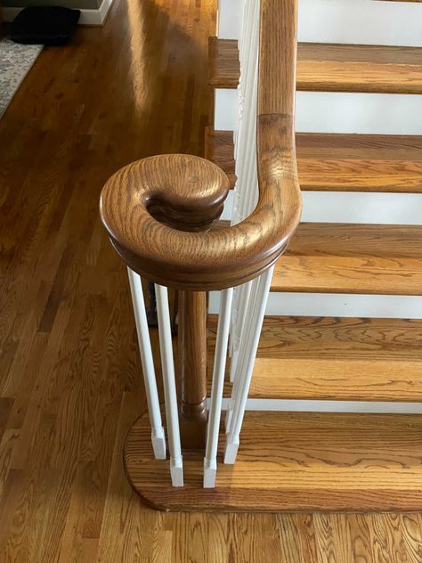 How to complete a modern staircase makeover to give your home an updated look. Follow along with our DIY staircase makeover. Updating Spindles On Stairs, Update Traditional Staircase, Updating Curved Staircase Railing, Updating 90s Staircase, Stair Railing Replacement, How To Update Stair Banister, Staircase Banister Makeover, Diy Stairway Makeover, Wooden Banister Ideas