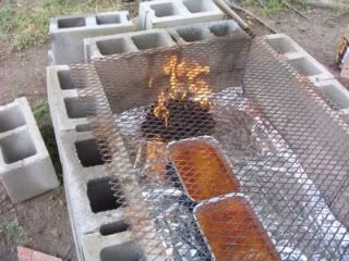 How to use cinderblocks to build a temporary back-yard barbecue pit to smoke a whole hog - for that BIG summer party :-) Inexpensive & super-simple to build & take down: see this link http://cowgirlscountry.blogspot.com/2007/03/cooking-whole-hog-on-cinder-block-pit_19.html Outdoor Cooking Pit, Backyard Smokers, Backyard Bbq Pit, Bbq Pit Smoker, Brick Bbq, Barbecue Pit, Pavers Backyard, Cinder Blocks, Diy Bbq