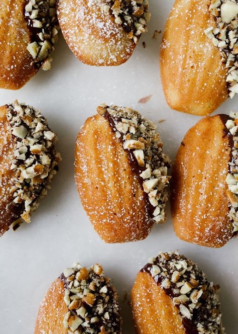 Brown Butter Bourbon Madeleines with Dark Chocolate Ganache and Pecans - Wood & Spoon Bourbon Ganache, Brown Butter Bourbon, بيتي فور, Madeline Cookies, Kue Macaroon, Madeleine Recipe, French Cookies, Dark Chocolate Ganache, Pecan Recipes